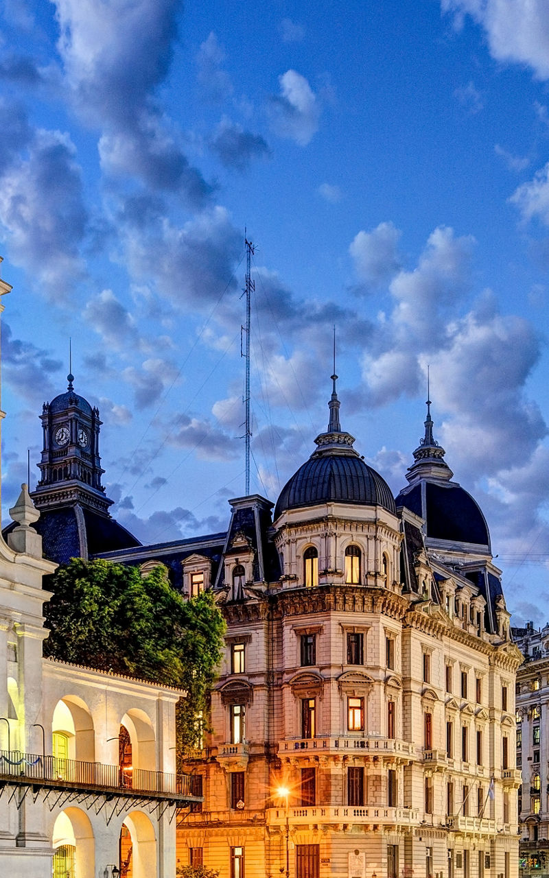 Historic Cabildo and cityscape at dusk