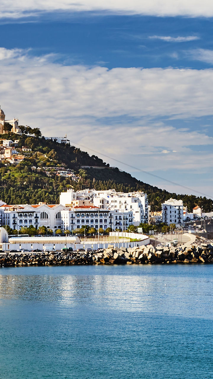 Coastal cityscape with serene blue waters