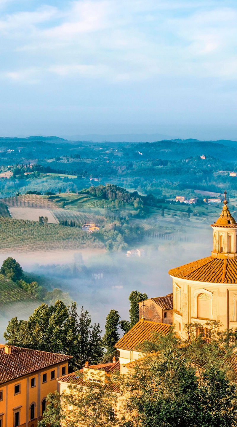 Scenic Tuscan village with rolling hills