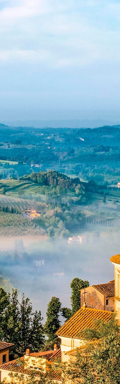 Scenic Tuscan village with rolling hills