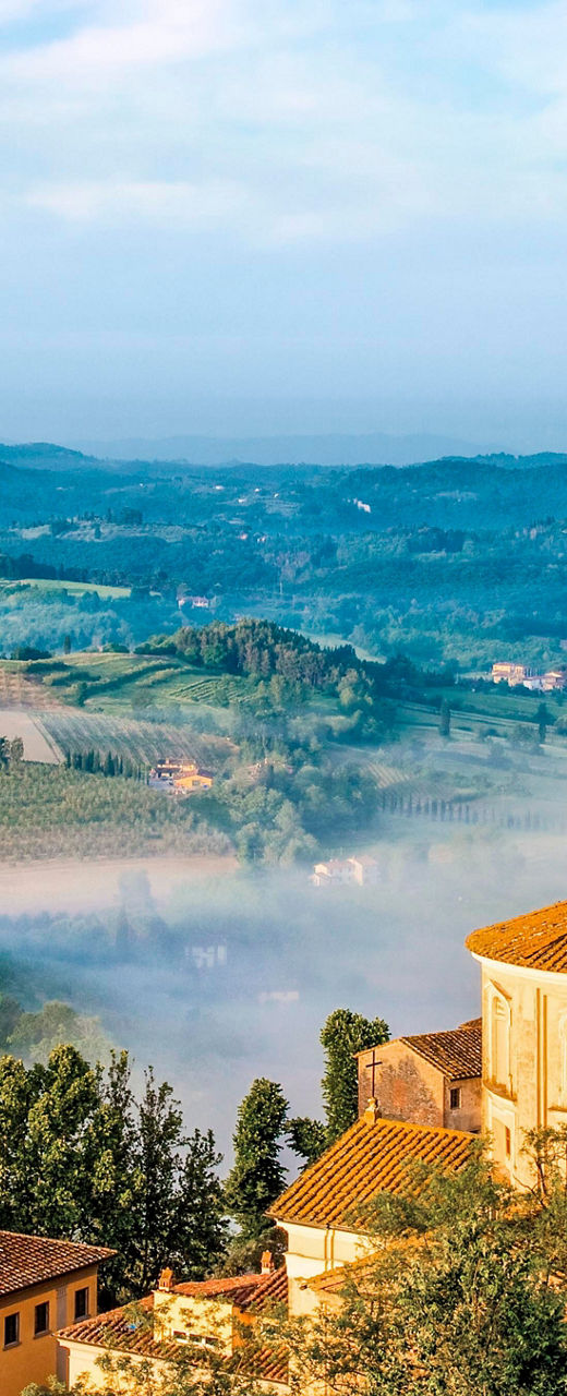 Scenic Tuscan village with rolling hills