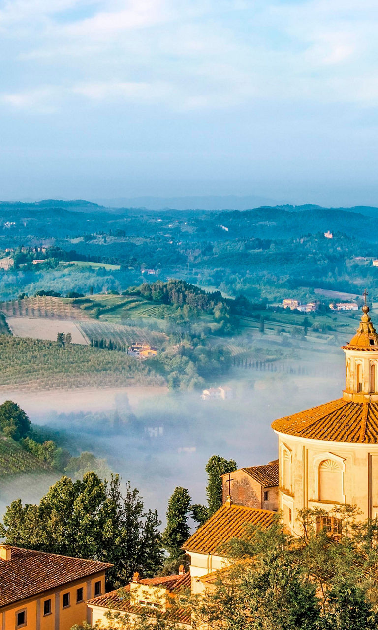 Scenic Tuscan village with rolling hills