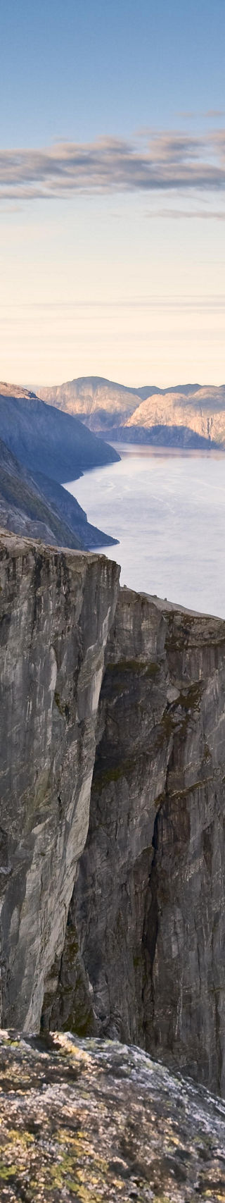 Scenic cliffside overlooking serene fjord
