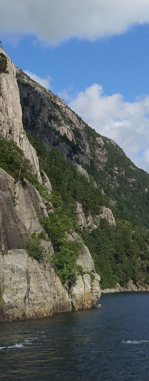 Scenic waterfall cascading into fjord
