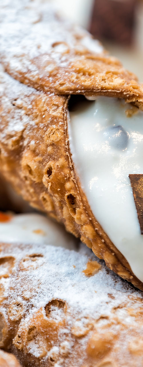 Close-up of freshly filled cannoli pastries