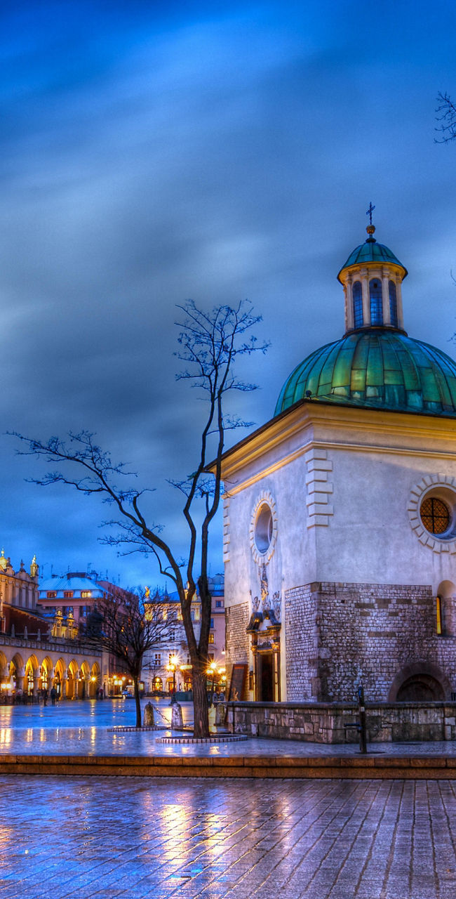 Historic Krakow square at dusk with vibrant sky