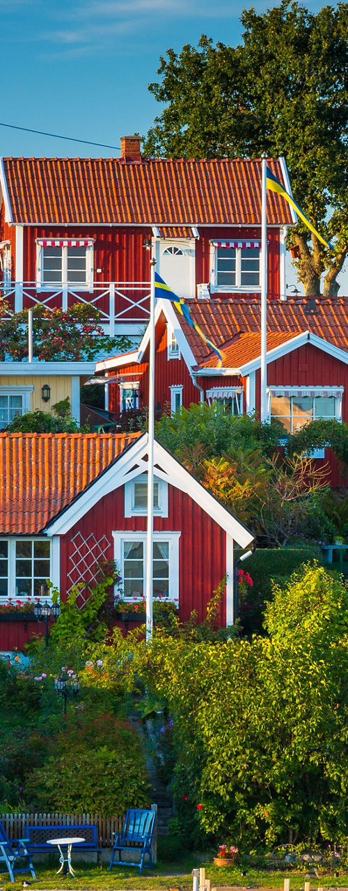 Scenic waterfront village with red cottages