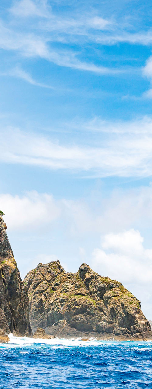 Rock arch formation by blue ocean waters