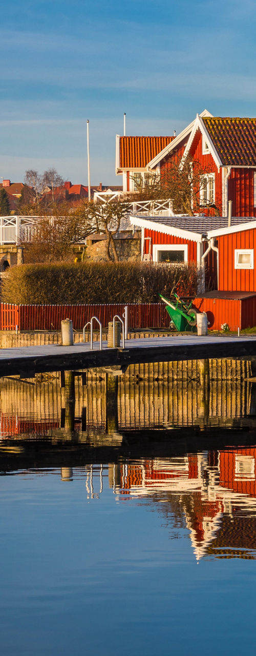 Scenic waterfront village with red houses
