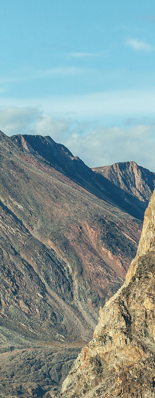 Majestic rocky mountains by blue water