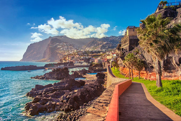 Coastal walkway with cliffs and ocean view