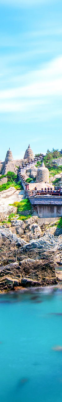 Scenic coastal temple with rocky shoreline