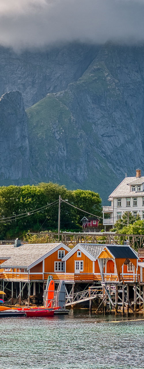 Scenic Nordic village with mountain backdrop