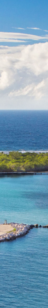 Tropical island coastline with clear skies