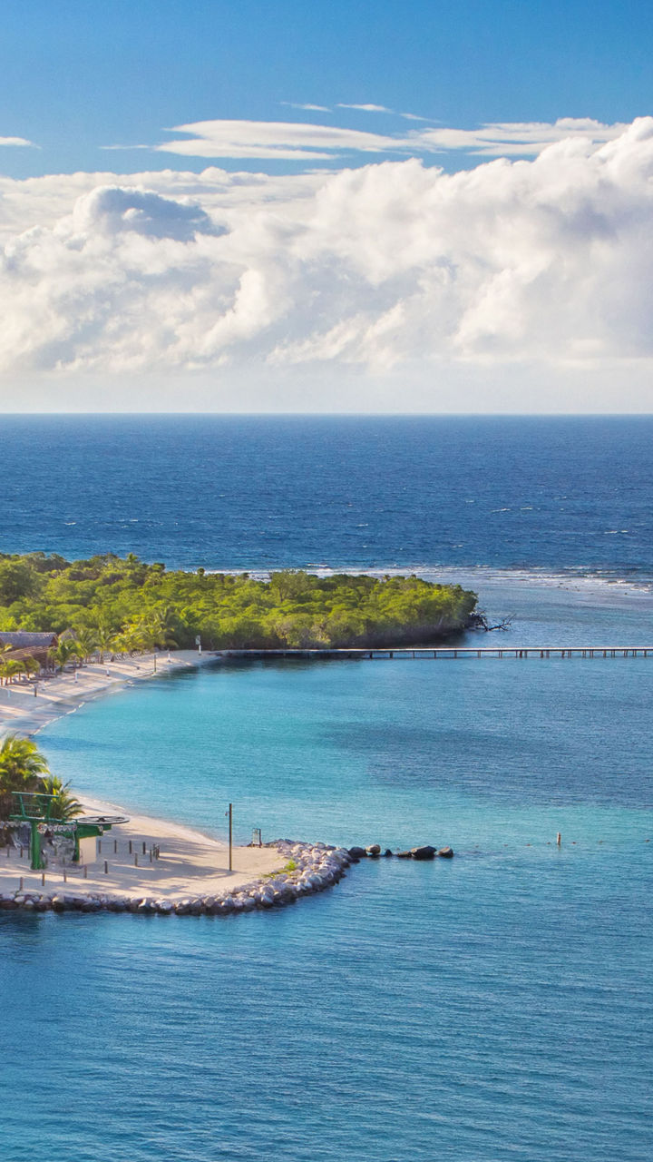 Tropical island coastline with clear skies