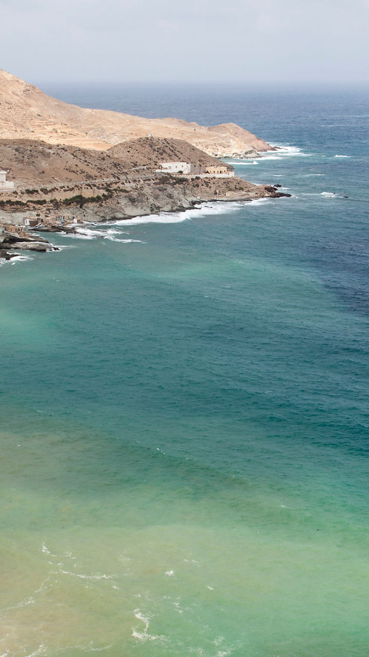Coastal village with rocky cliffs and ocean view