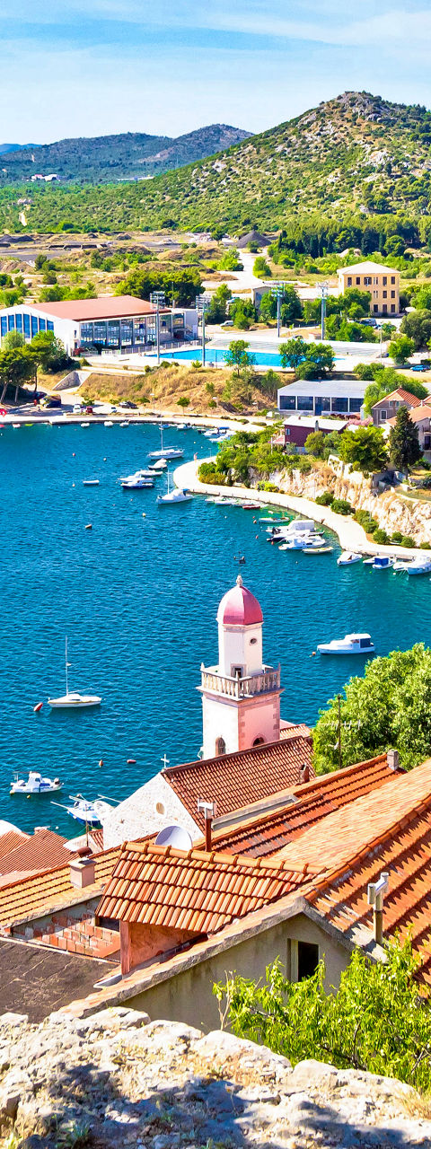 Scenic coastal town with red rooftops