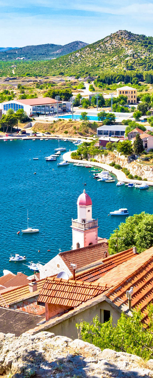 Scenic coastal town with red rooftops