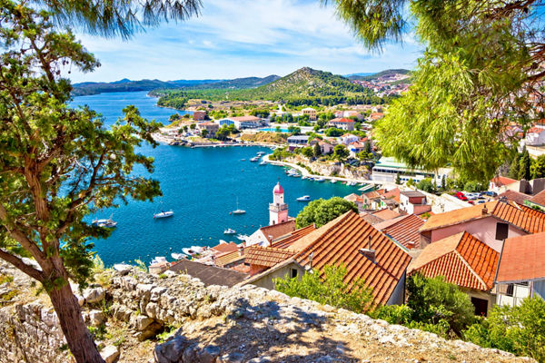 Scenic coastal town with red rooftops