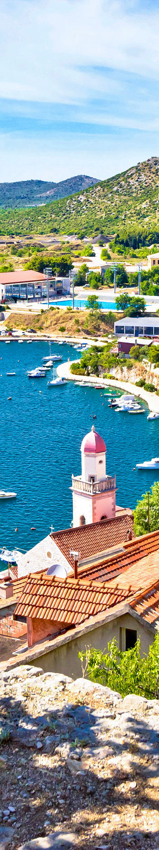Scenic coastal town with red rooftops