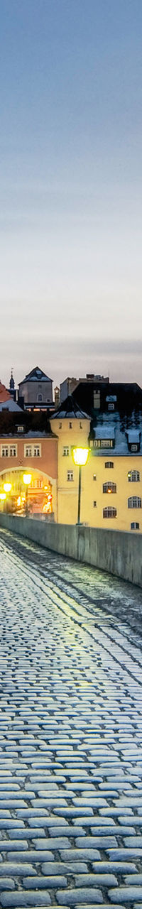 Historic stone bridge at dusk in Regensburg