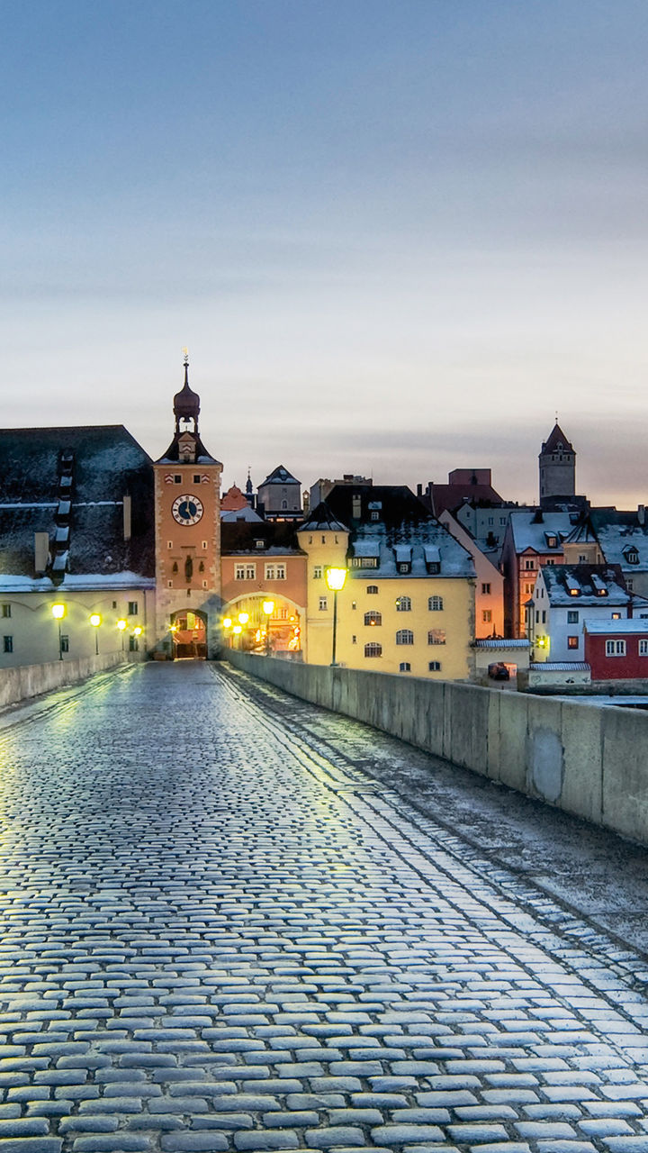 Historic stone bridge at dusk in Regensburg