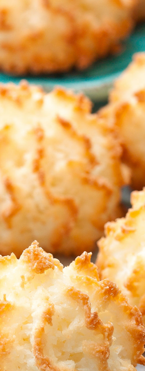 Golden coconut macaroons on blue napkin