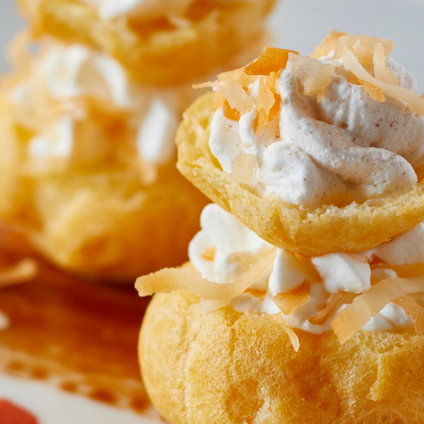 Cream-filled pastries with tropical garnish