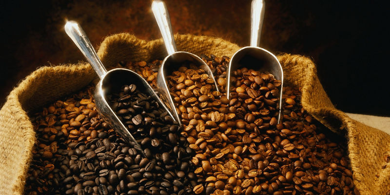 Variety of coffee beans in burlap sack