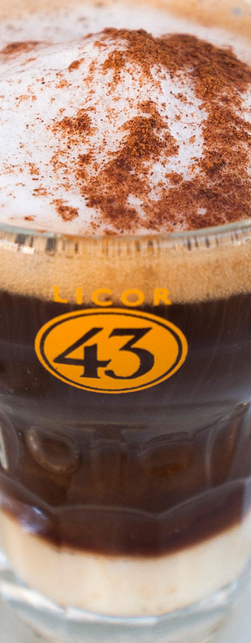 Glass of coffee with Licor 43 logo