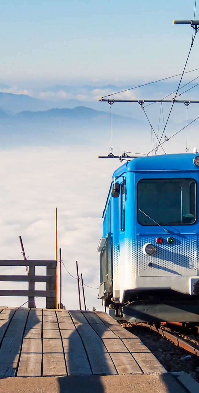 Blue mountain train above the clouds