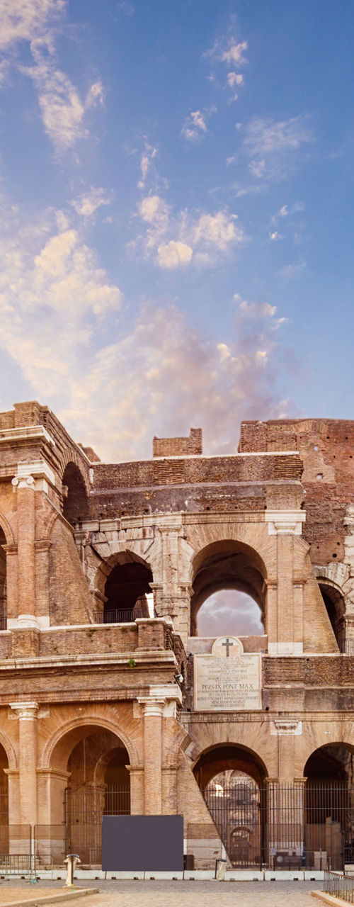 Colosseum at sunrise with vibrant sky