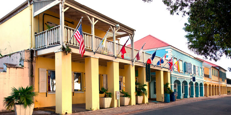 Colorful colonial buildings with flags displayed