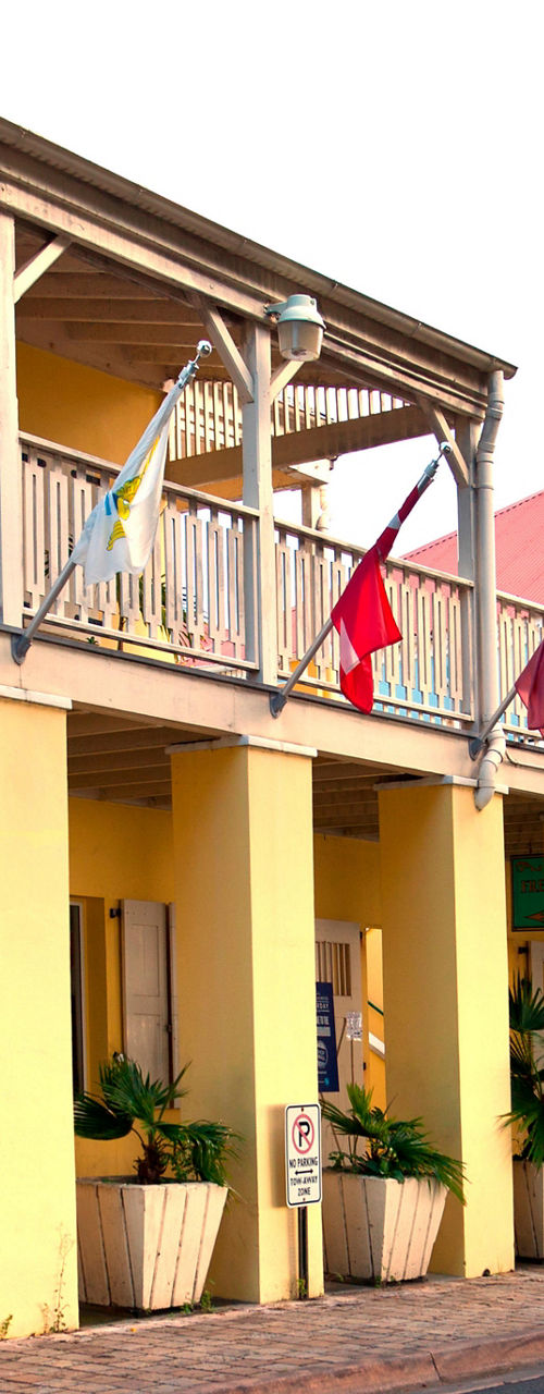 Colorful colonial buildings with flags displayed