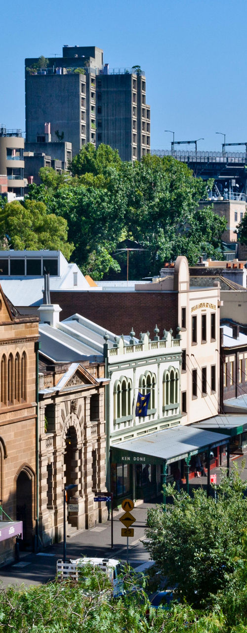 Historic Sydney street with urban skyline