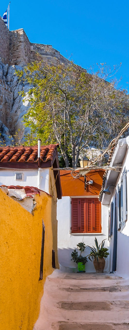 Charming alley with vibrant houses and castle view