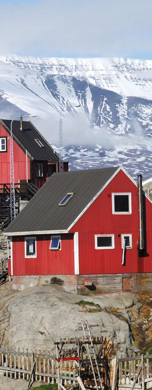 Colorful houses on snowy mountain slope