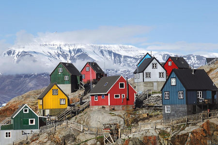 Colorful houses on snowy mountain slope