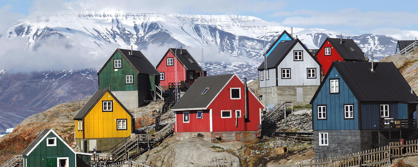 Colorful houses on snowy mountain slope