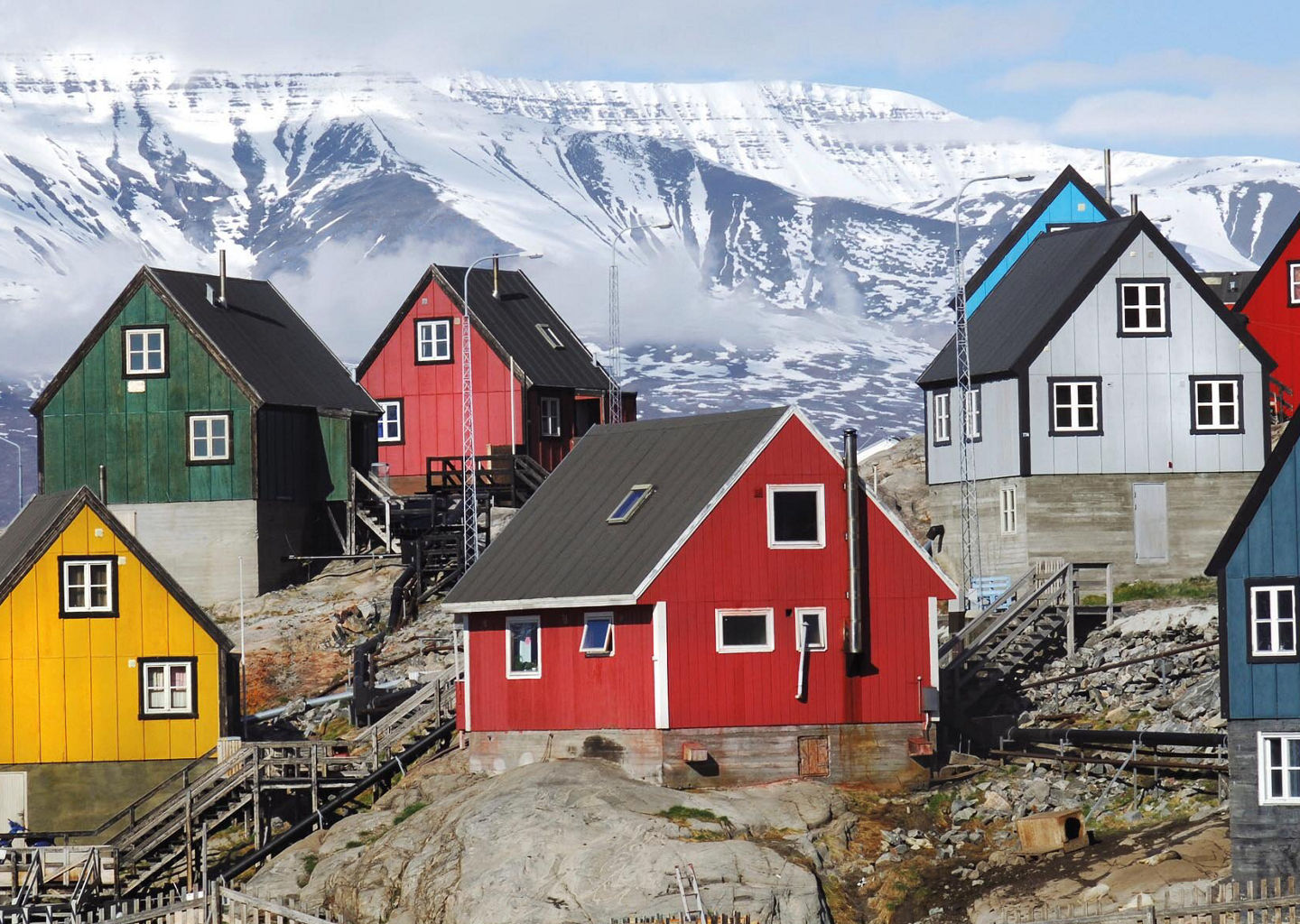 Colorful houses on snowy mountain slope
