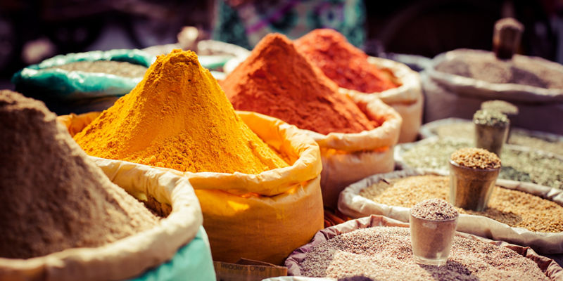 Colorful spice market with vibrant powders