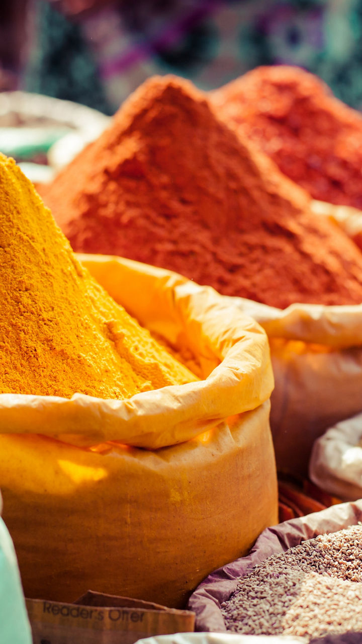 Colorful spice market with vibrant powders
