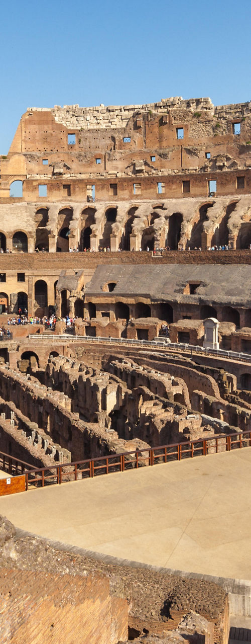 Historic Colosseum under clear blue sky