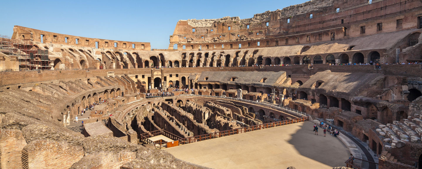 Historic Colosseum under clear blue sky