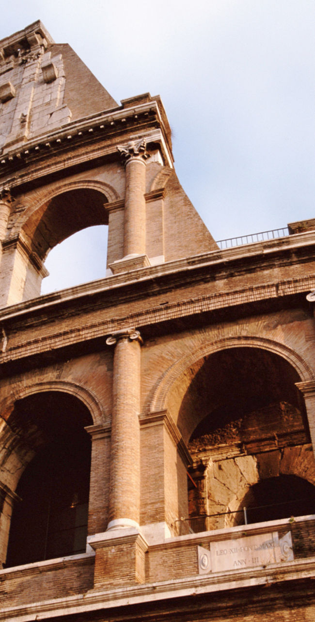 Historic Colosseum under a cloudy sky