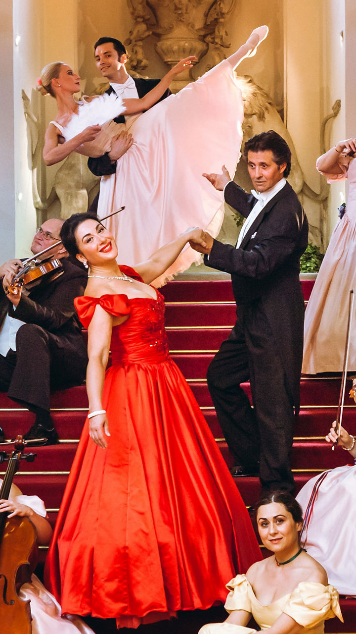 Orchestra in formal attire on staircase