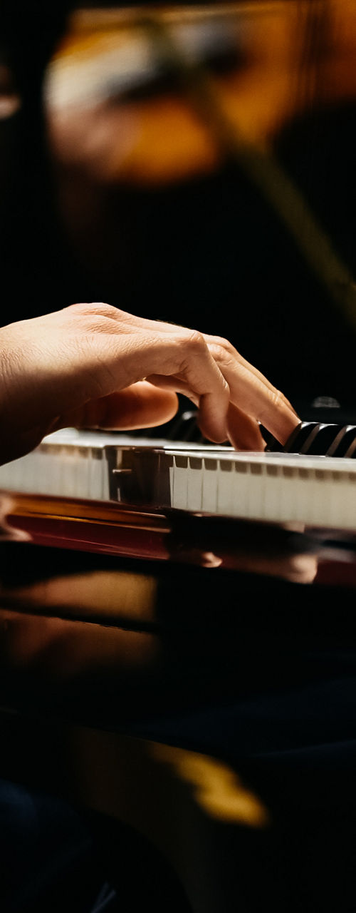 Pianist performing in formal concert setting