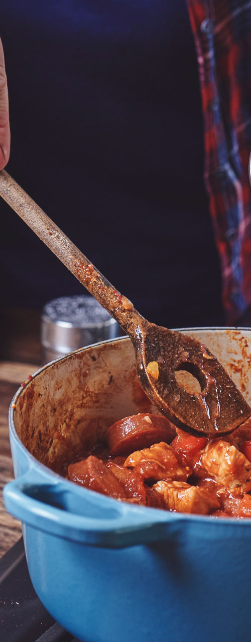 Cooking stew in blue pot on stove