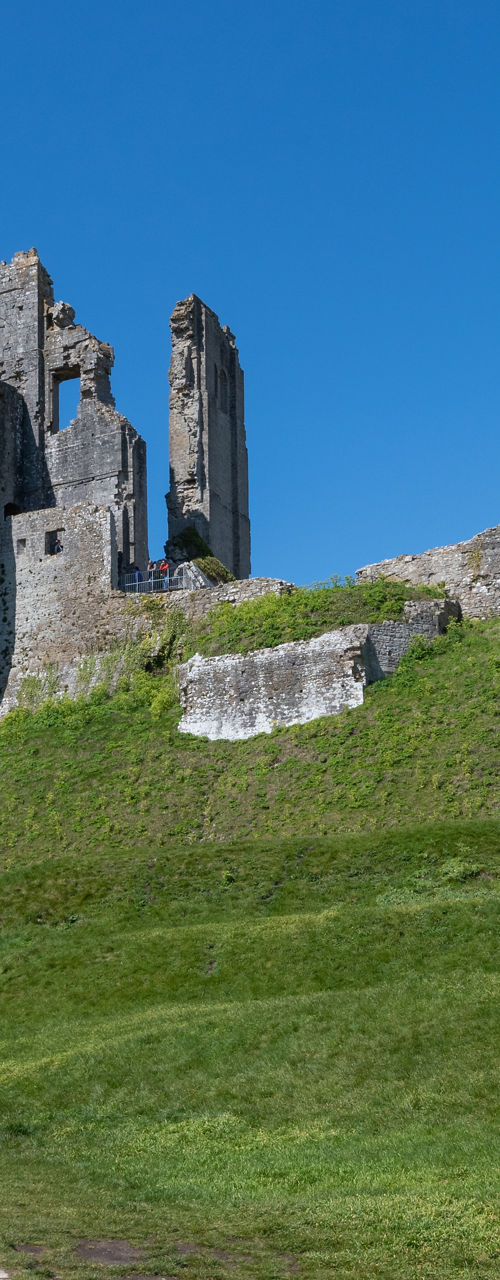 Historic castle ruins under clear blue sky