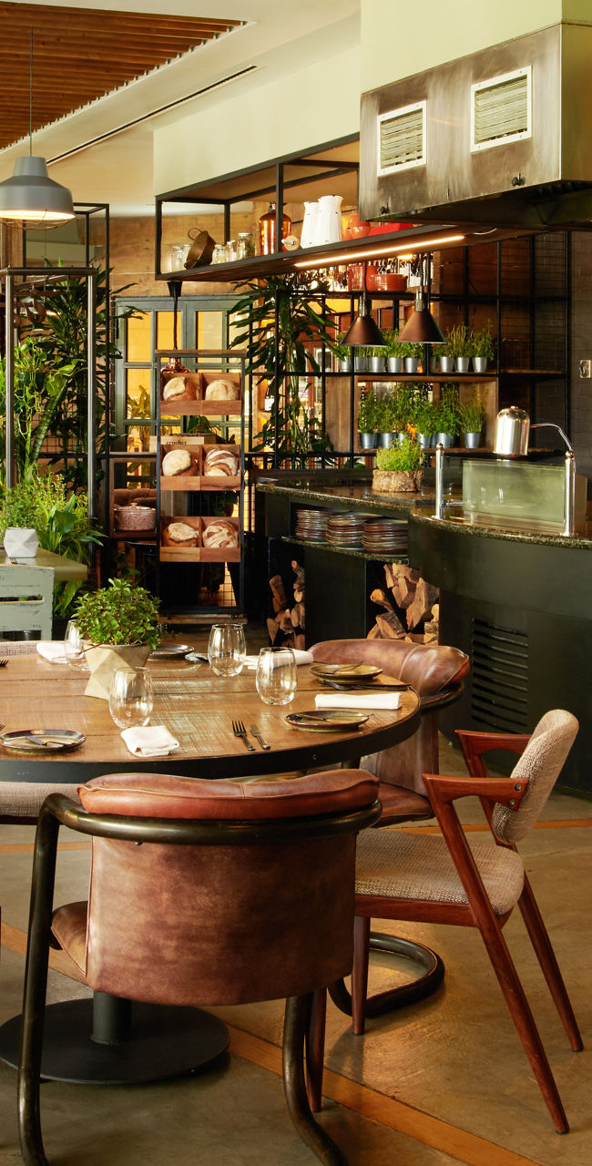 Cozy restaurant with lush greenery decor
